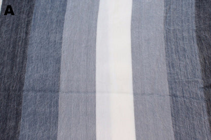 Closeup of the gray and white striped alpaca blanket's weave