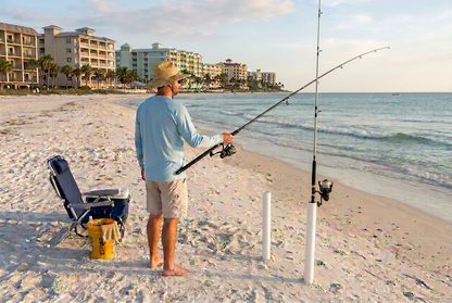 Beach fishing preview with the rod standing vertically in its sand spike