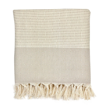 Folded beige and cream diamond stripe Turkish throw with knotted tassel fringe
