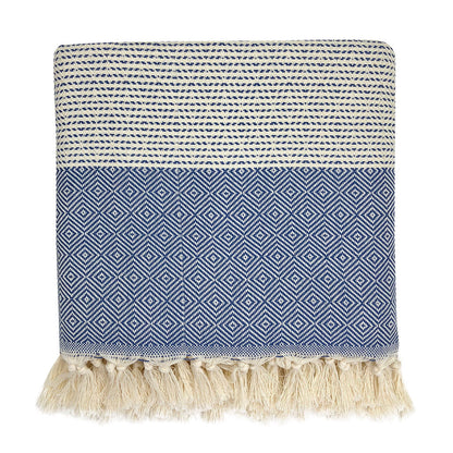 Folded navy blue and cream diamond stripe Turkish throw with cream tassel fringe