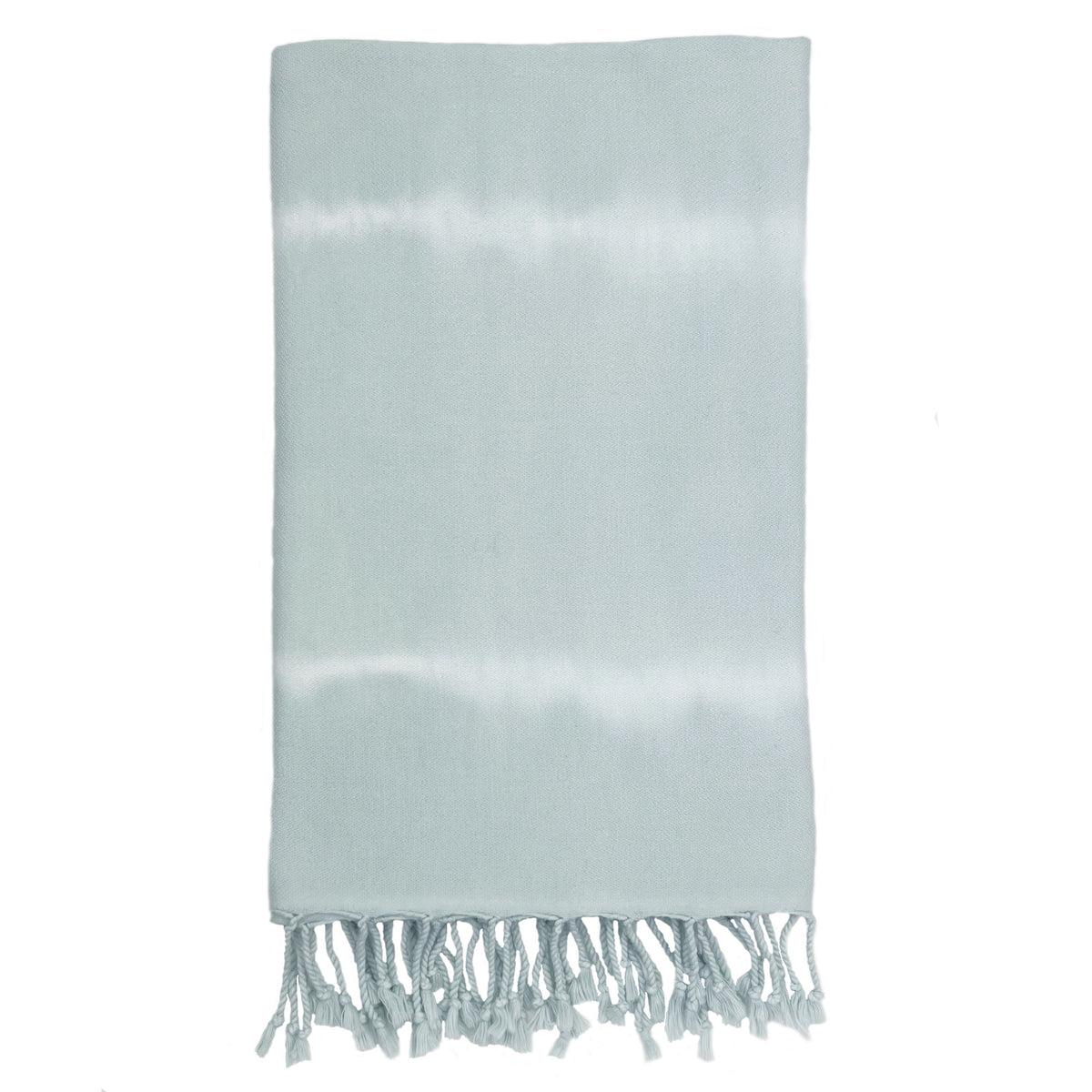 Folded pale blue Ocean tie-dye Turkish beach towel with twisted fringe