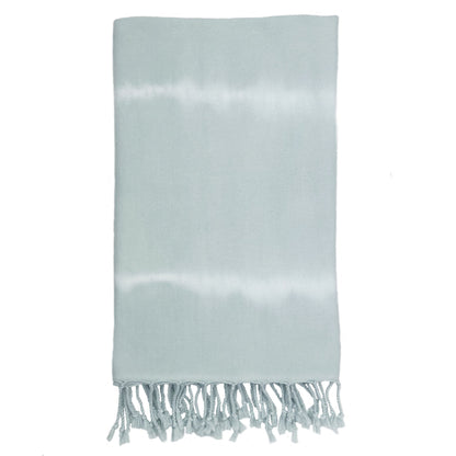 Folded pale blue Ocean tie-dye Turkish beach towel with twisted fringe