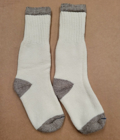 Pair of cream OutdoorAdventure alpaca socks with gray toe, heel, and cuff