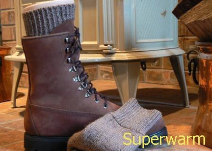 Brown hiking boot and a folded gray Superwarm alpaca sock with a Superwarm text overlay