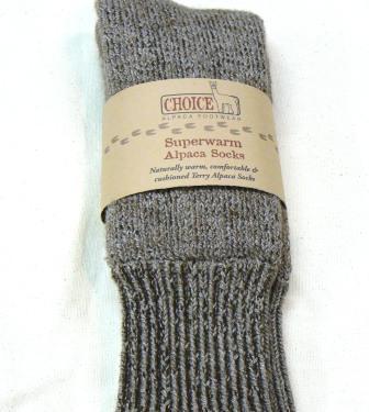 Gray Superwarm alpaca socks folded with a Choice Alpaca Footwear paper band